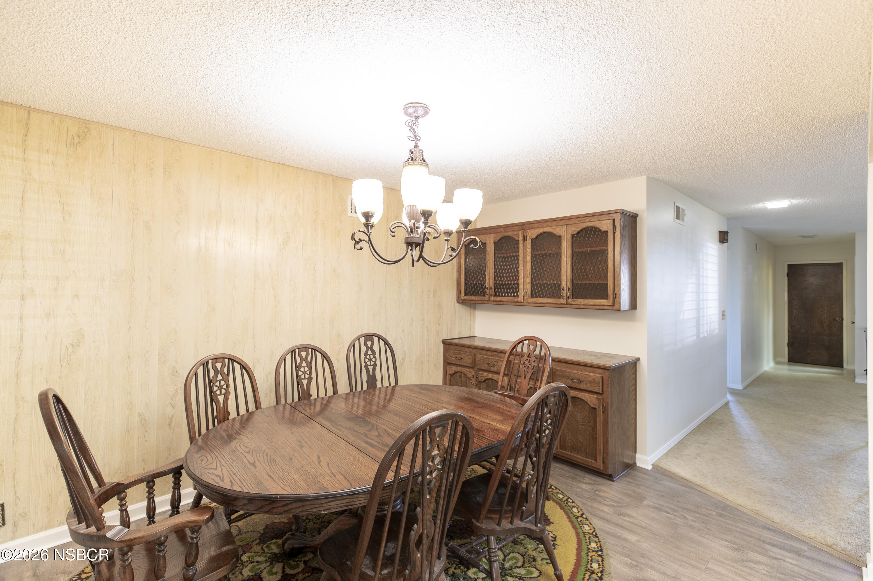 205 South E Street Lompoc, CA 93436 - Photo 14 of 49 a view of a dining room with furniture and chandelier