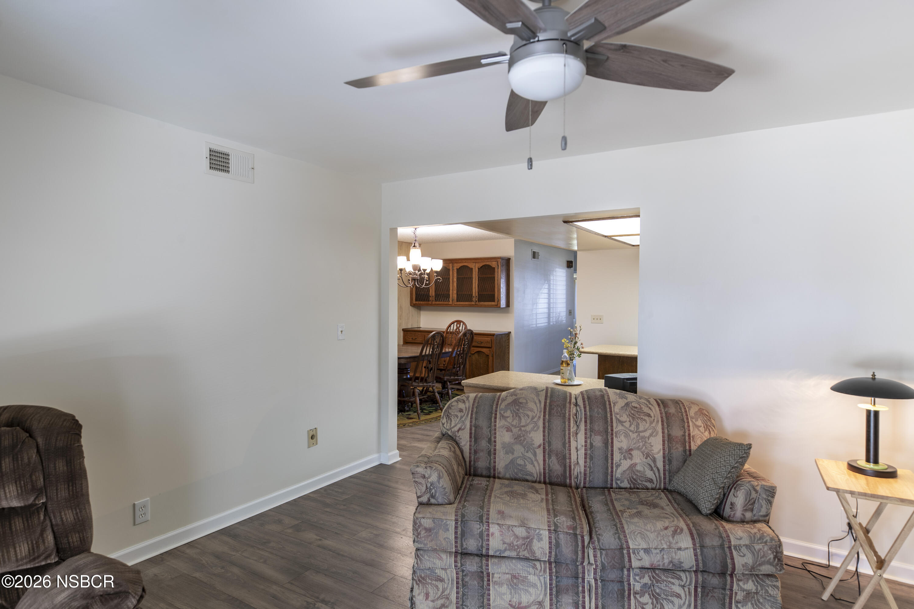 205 South E Street Lompoc, CA 93436 - Photo 19 of 49 a living room with furniture and a chandelier