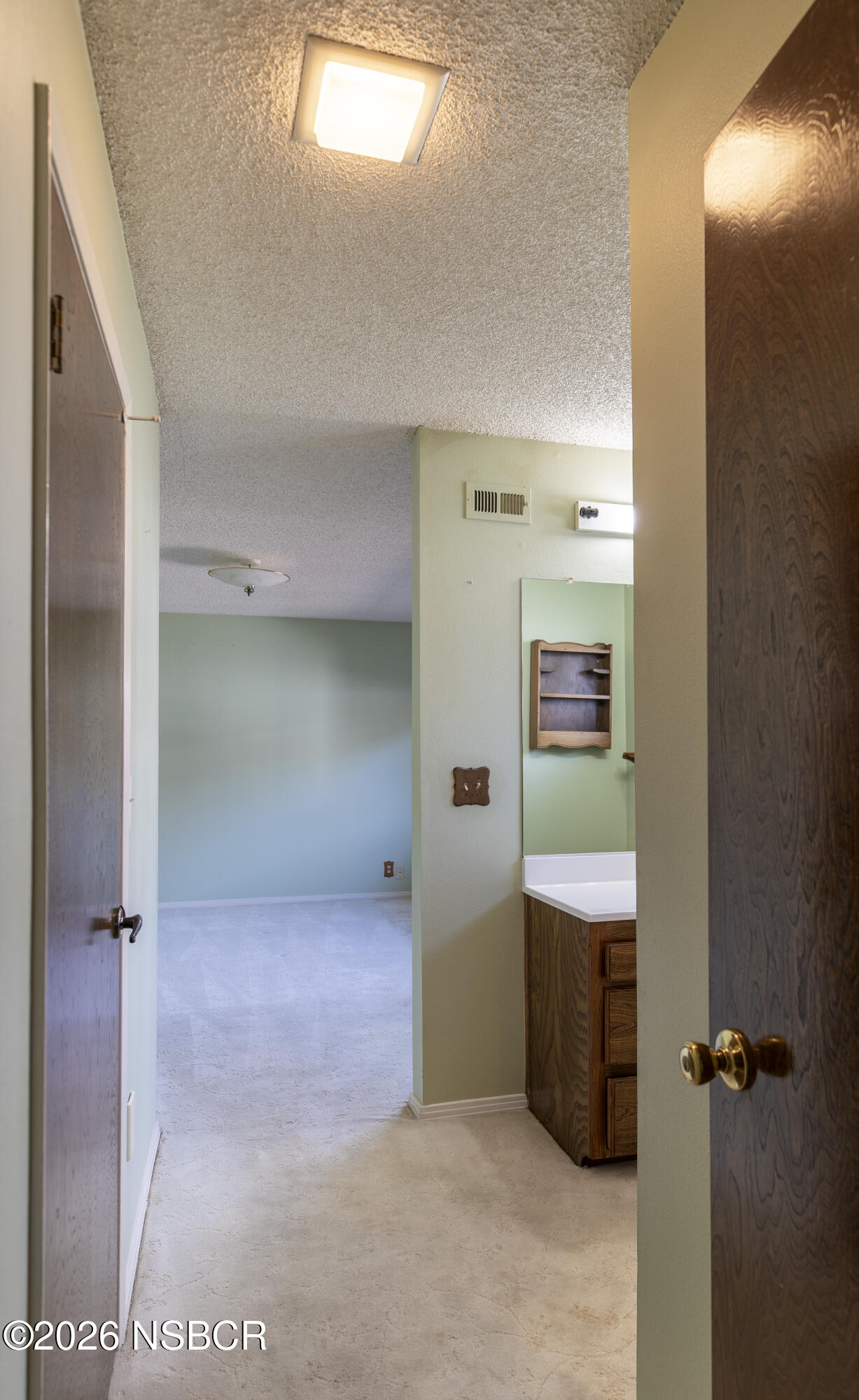 205 South E Street Lompoc, CA 93436 - Photo 21 of 49 a view of a hallway to rooms