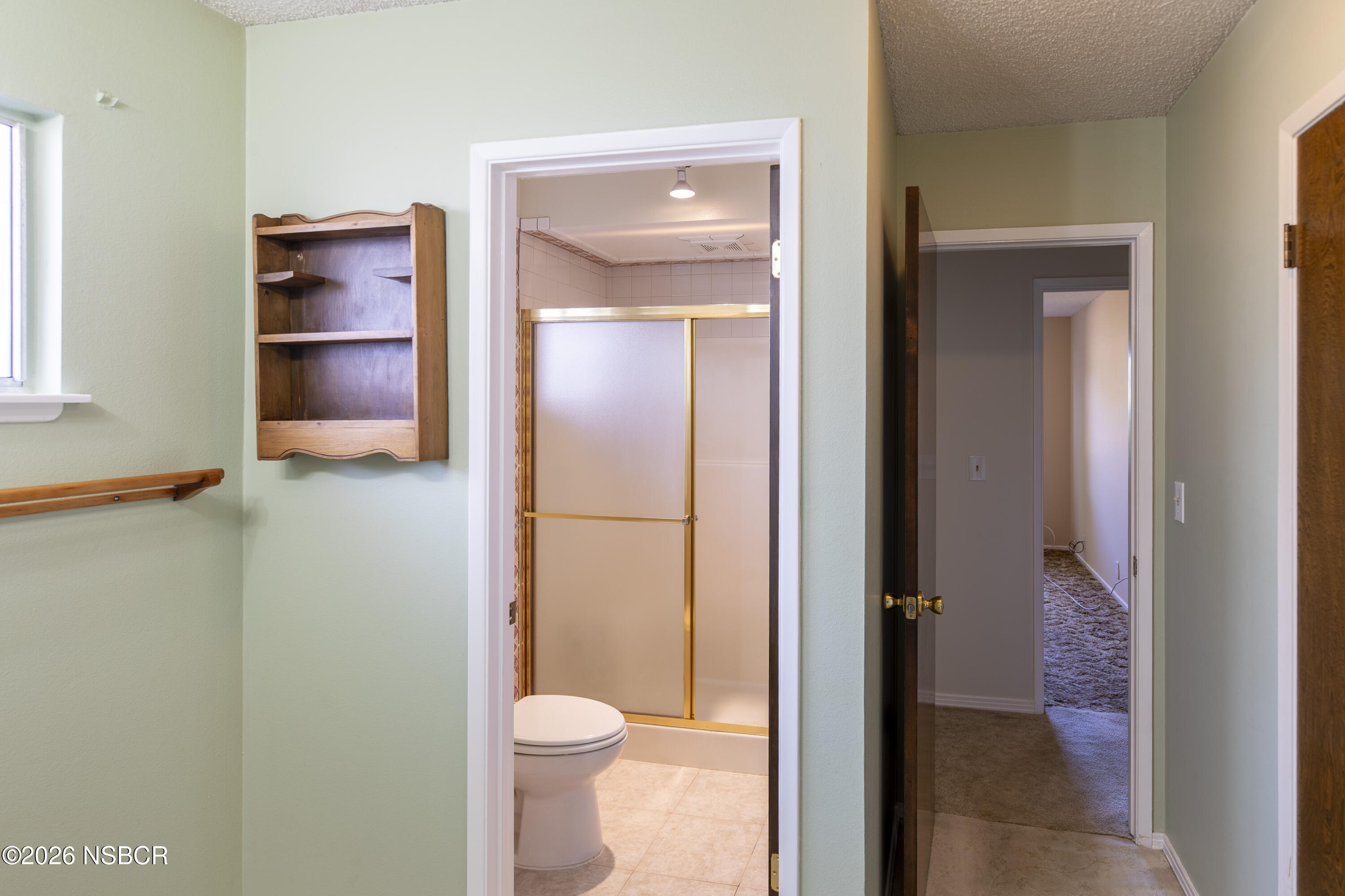 205 South E Street Lompoc, CA 93436 - Photo 26 of 49 a bathroom with a toilet and a sink