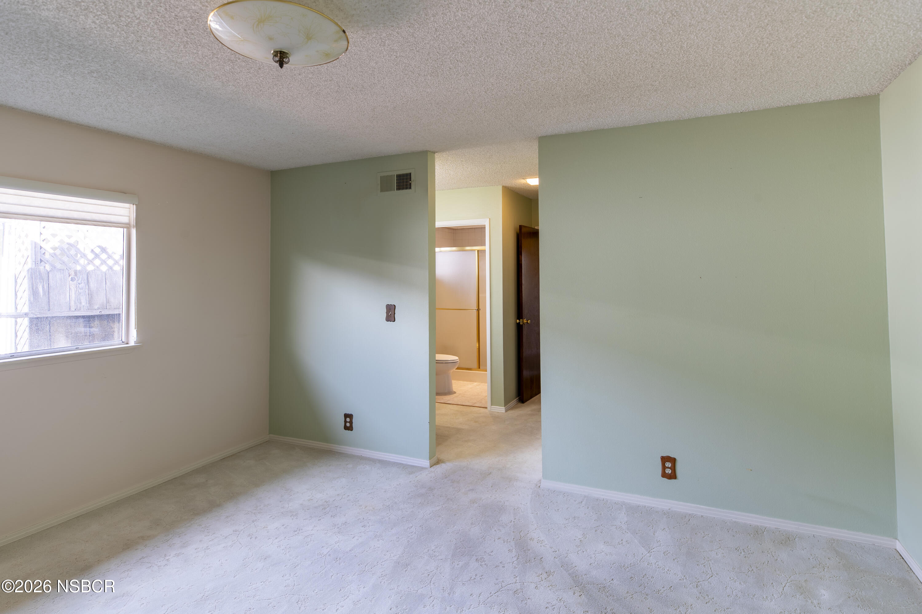 205 South E Street Lompoc, CA 93436 - Photo 27 of 49 an empty room with an entryway