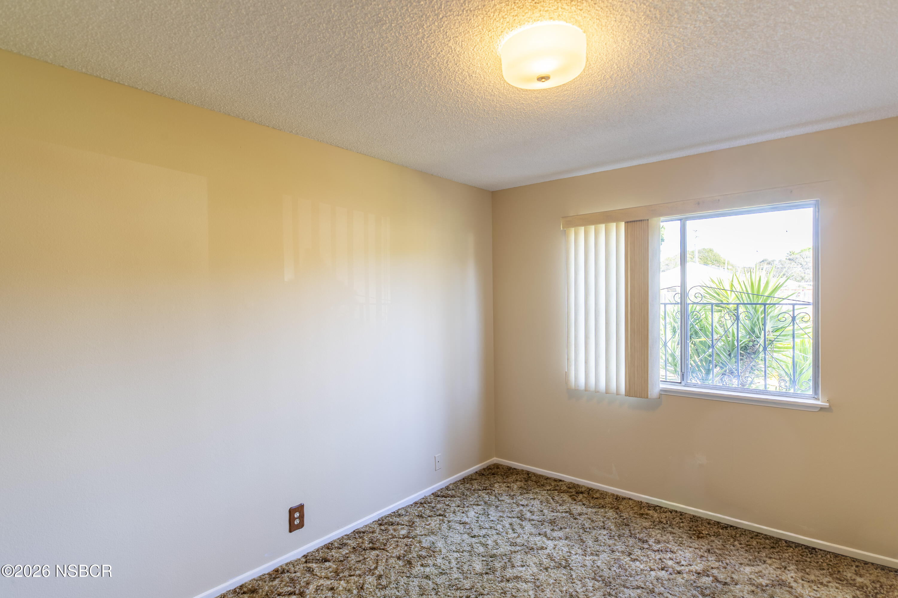 205 South E Street Lompoc, CA 93436 - Photo 28 of 49 a view of an empty room with a window