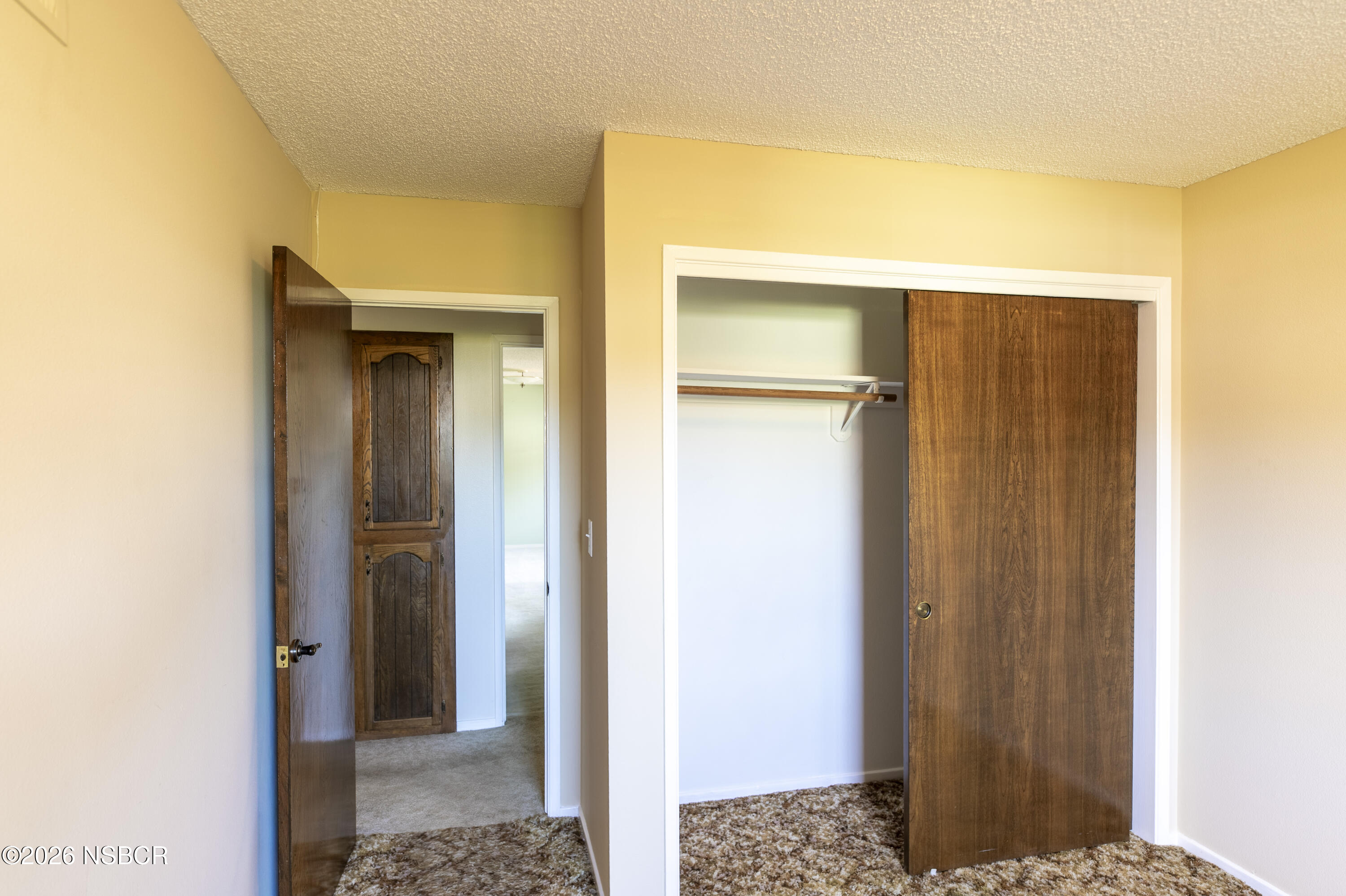 205 South E Street Lompoc, CA 93436 - Photo 29 of 49 a view of a bathroom from a hallway