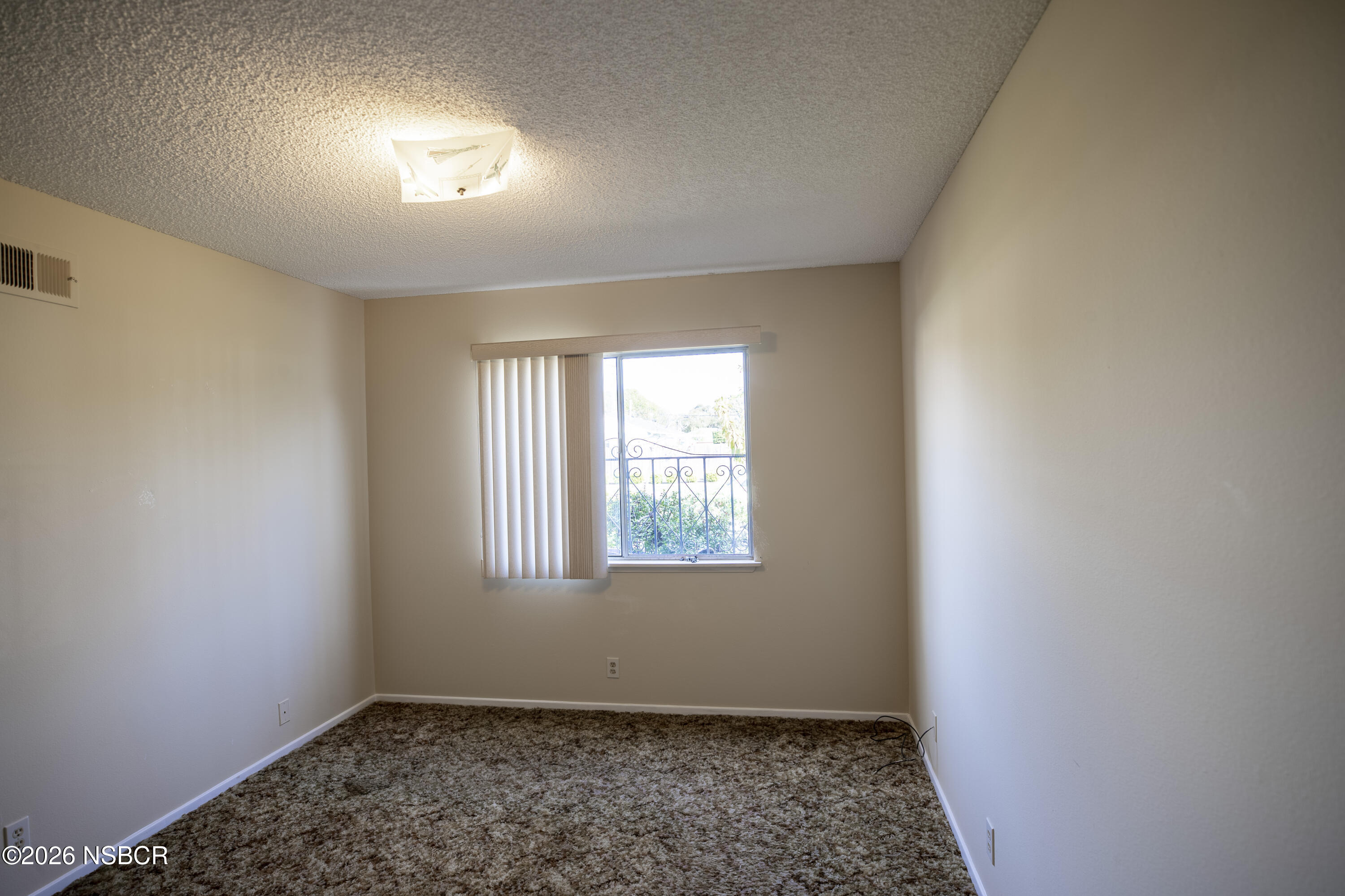 205 South E Street Lompoc, CA 93436 - Photo 30 of 49 an empty room with windows
