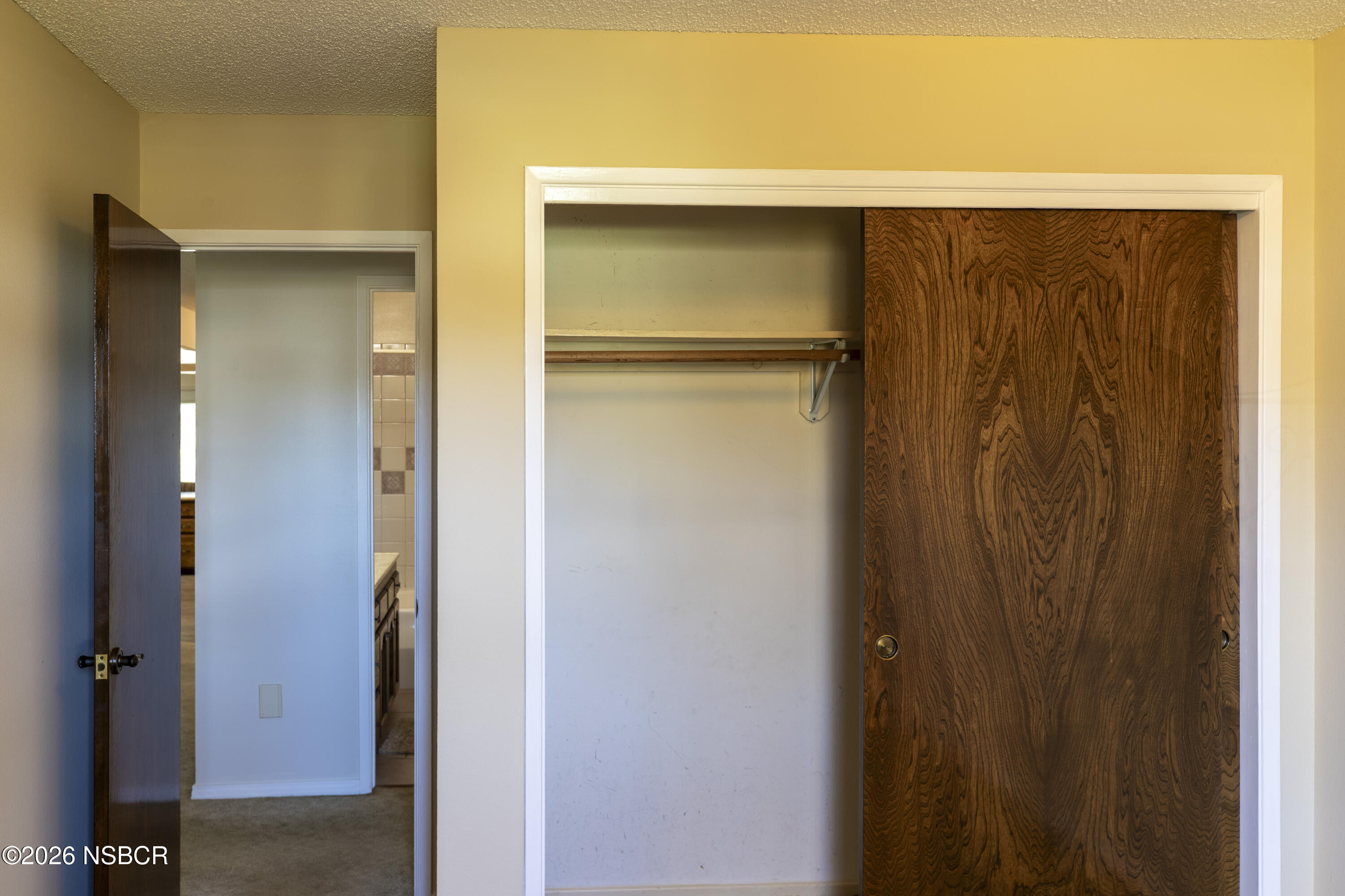 205 South E Street Lompoc, CA 93436 - Photo 31 of 49 a bathroom with a shower and a door