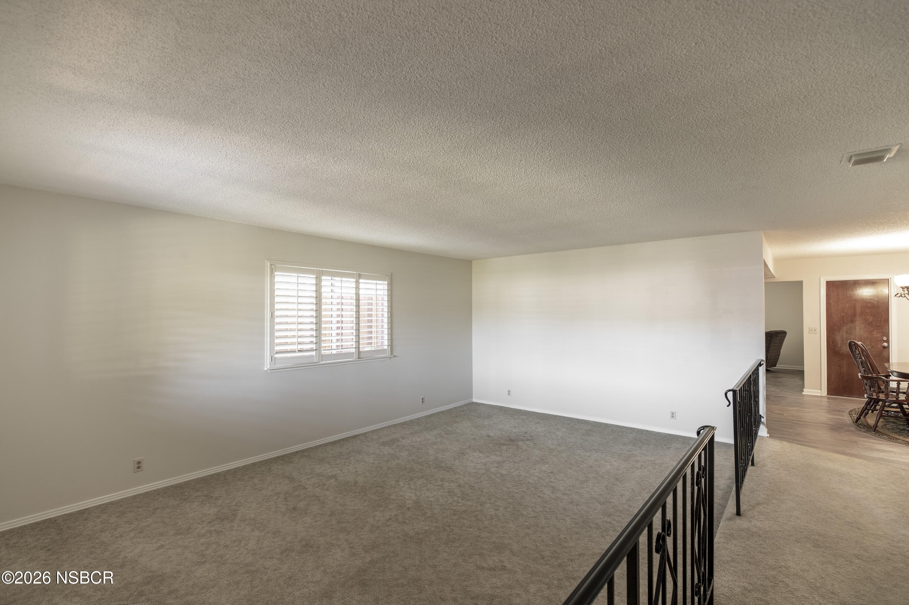 205 South E Street Lompoc, CA 93436 - Photo 6 of 49 an empty room with a window