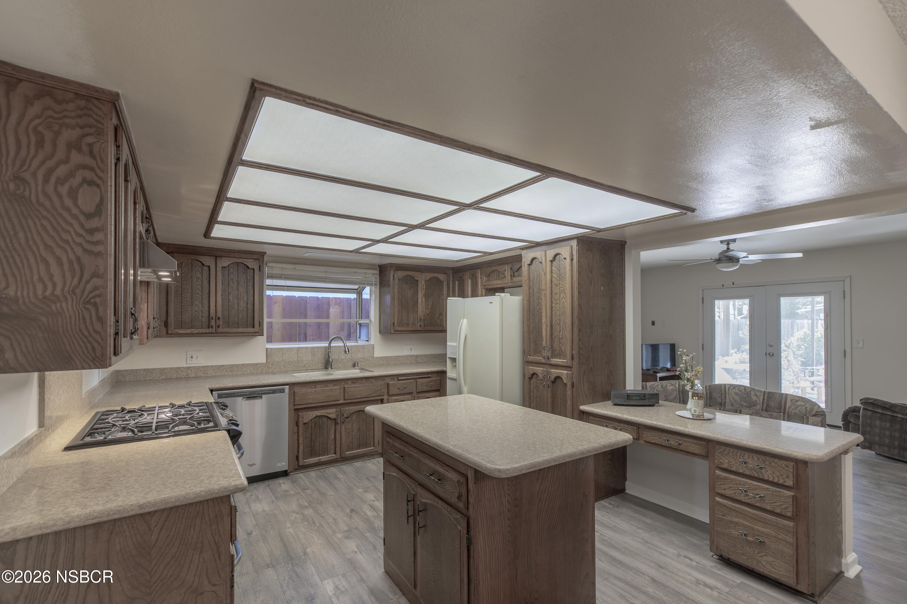 205 South E Street Lompoc, CA 93436 - Photo 8 of 49 a kitchen with stainless steel appliances granite countertop a sink stove and refrigerator