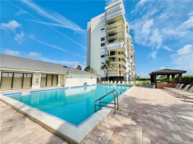 a kitchen with stainless steel appliances granite countertop a refrigerator and a refrigerator