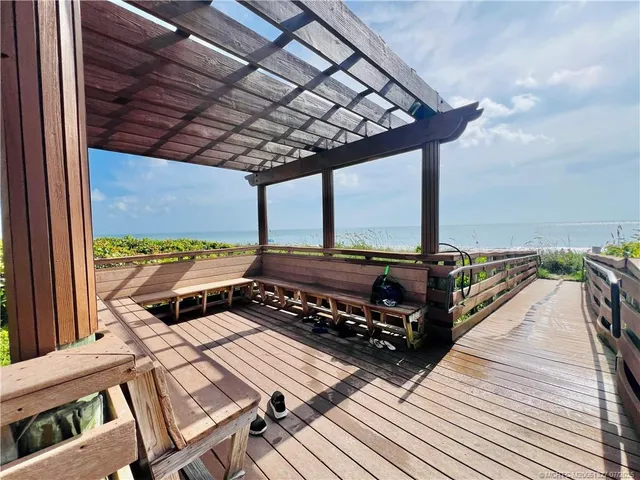 a view of a workspace with furniture and gym equipment