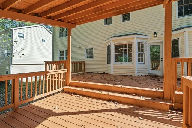 a view of a house with a door and wooden floor