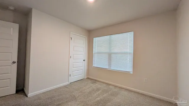 an empty room with closet and closet