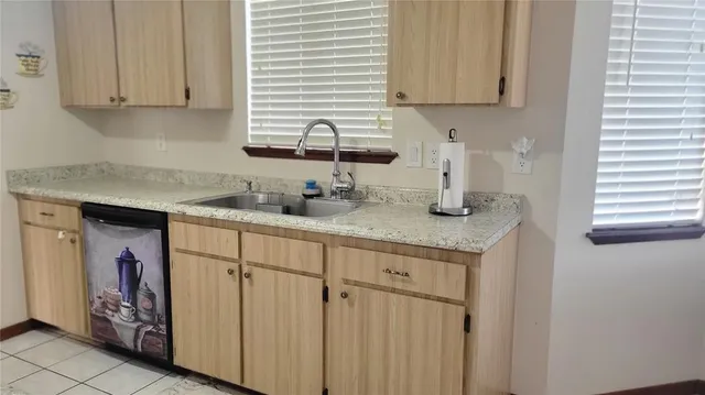 a kitchen with stainless steel appliances granite countertop a sink and a cabinets