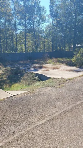 a view of swimming pool next to a yard