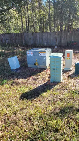 a backyard view with hardwood wall and tree