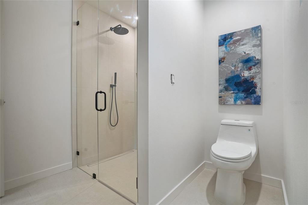2370 Robyn Court Dunedin, FL 34698 - Photo 20 of 37 a bathroom with a toilet and a shower