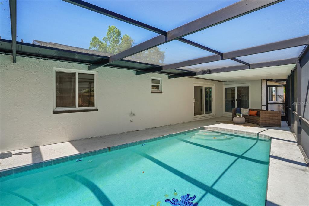 2370 Robyn Court Dunedin, FL 34698 - Photo 31 of 37 a view of a backyard with a patio
