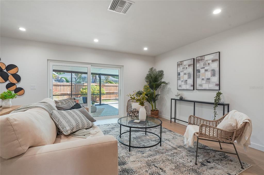 2370 Robyn Court Dunedin, FL 34698 - Photo 6 of 37 a living room with furniture and a large window