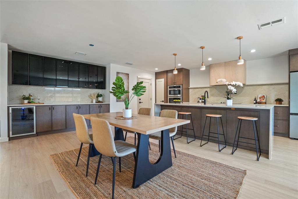 2370 Robyn Court Dunedin, FL 34698 - Photo 7 of 37 a kitchen with a table and chairs in it