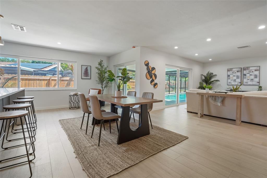 2370 Robyn Court Dunedin, FL 34698 - Photo 10 of 37 a view of a dining room with furniture and a wooden floor