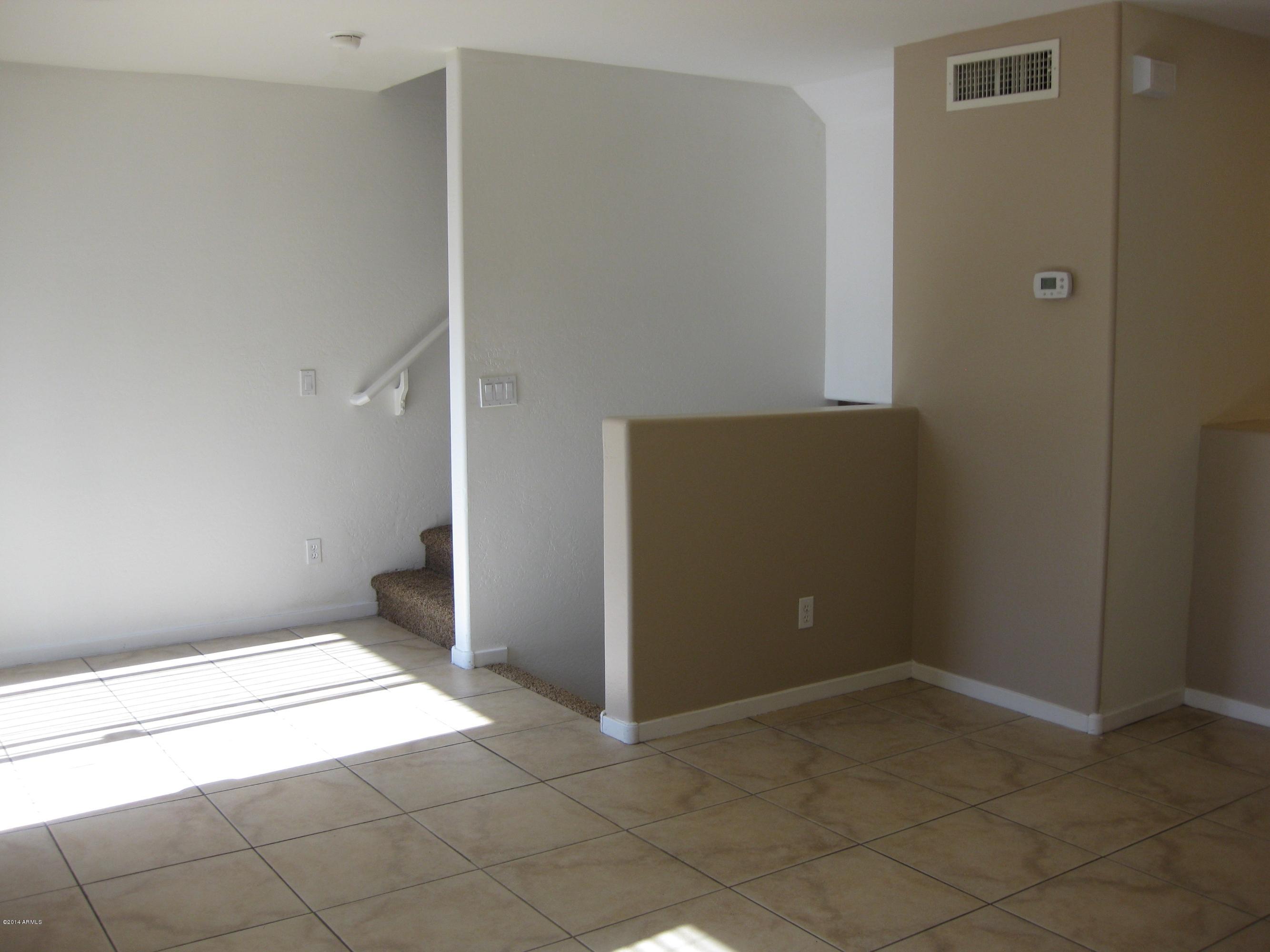 305 South Wilson Street, Unit 111 Tempe, AZ 85281 - Photo 7 of 48 an empty room with entrance