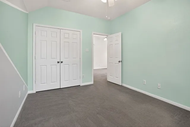 an empty room with closet area