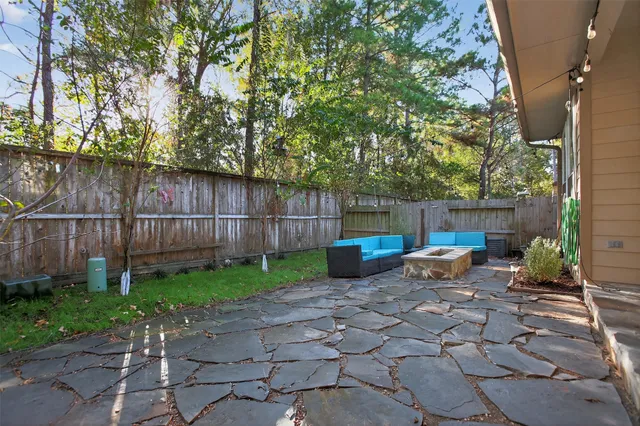 a view of a backyard with a small cabin and a chair