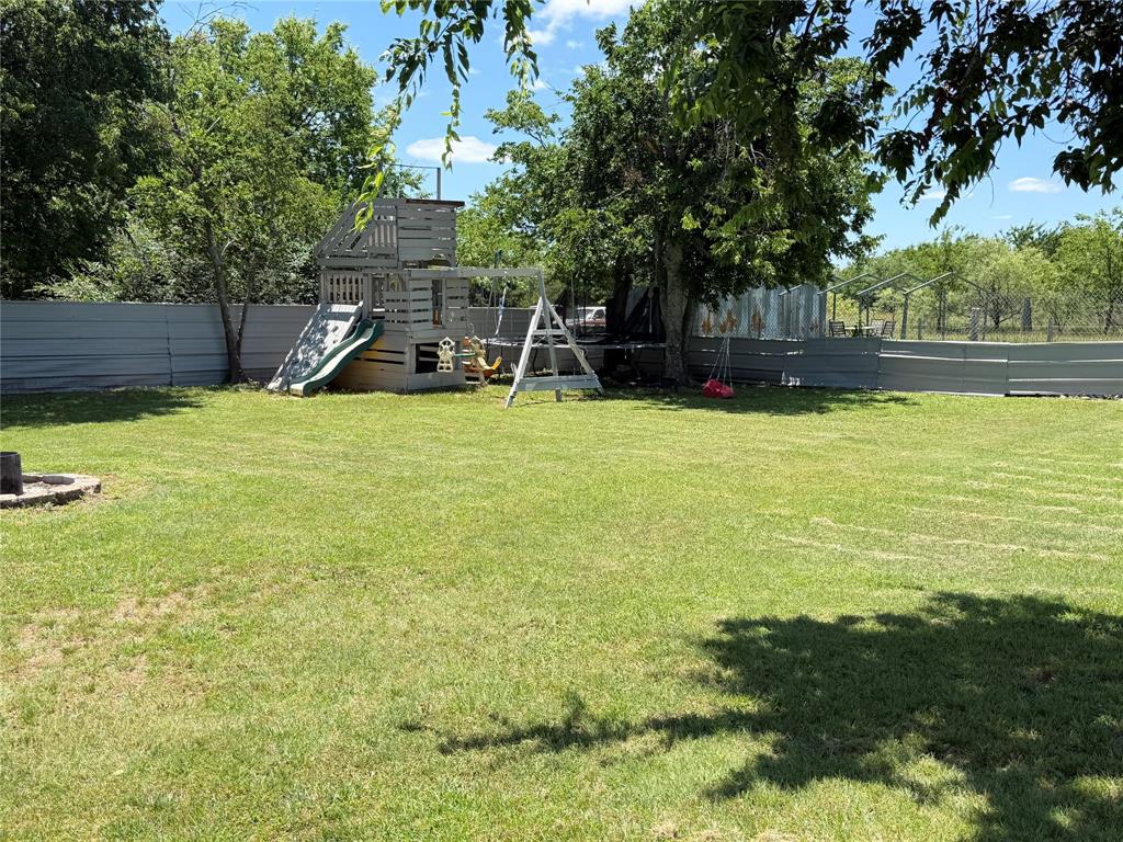 222 Hix Road Cleburne, TX 76031 - Photo 27 of 27 a front view of a house with a yard and trees