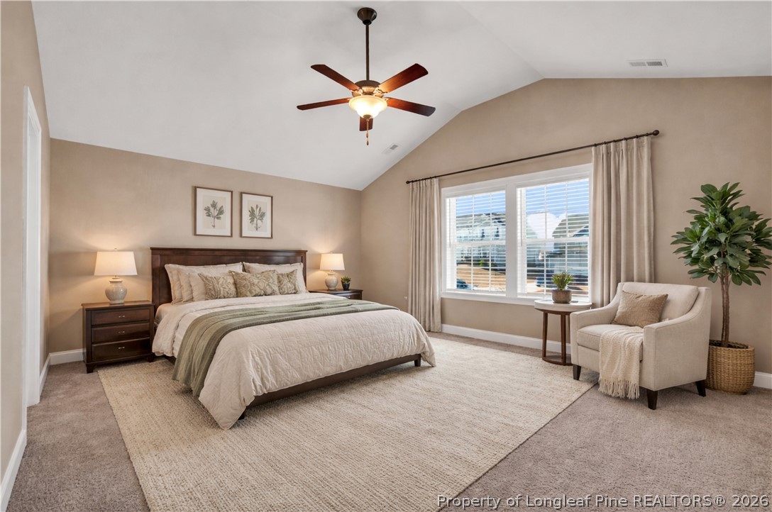 448 Pittfield Run Cameron, NC 28326 - Photo 30 of 43 a bedroom with a bed and a large window