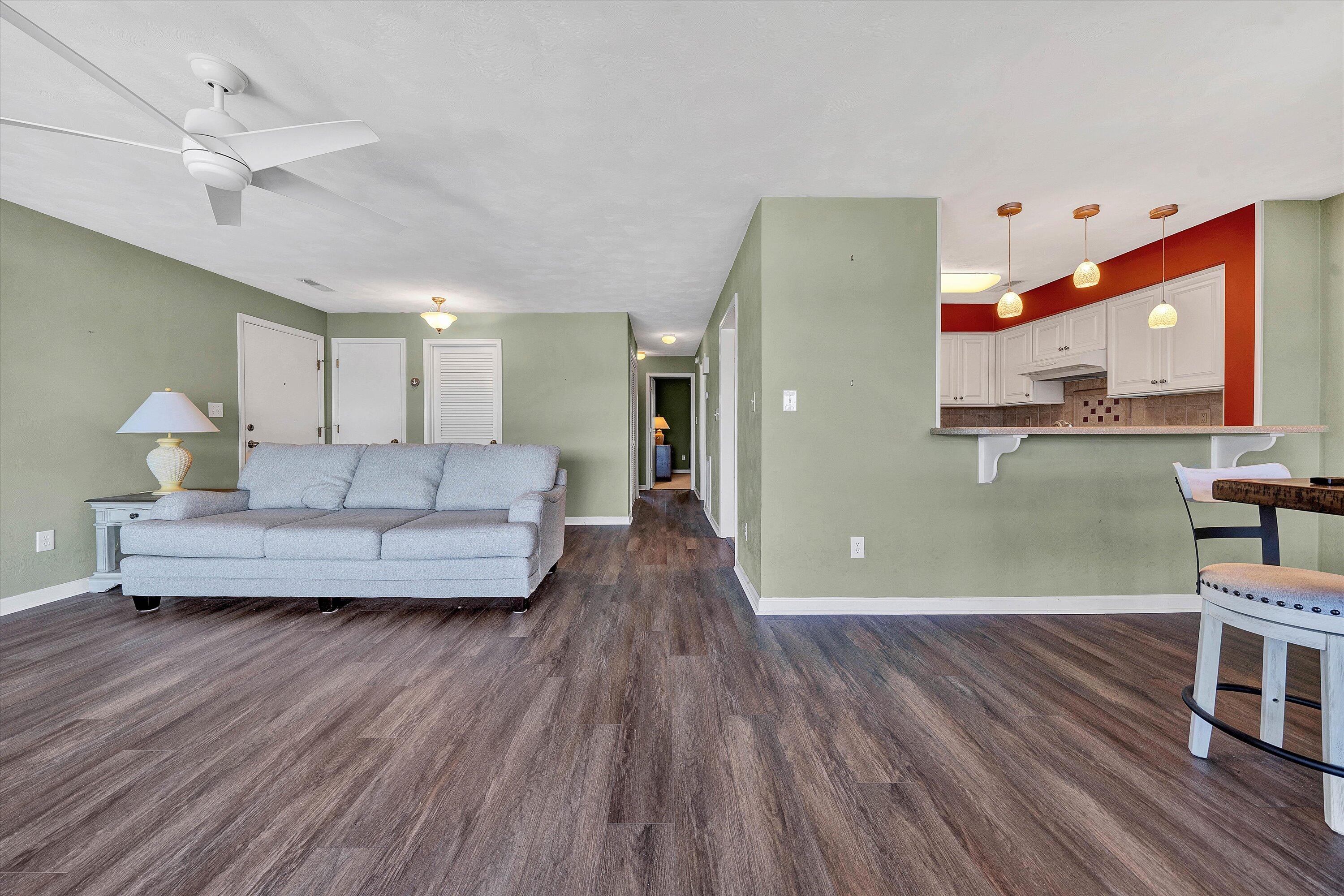 845 Gangplank Road, Unit 210 Moneta, VA 24121 - Photo 13 of 34 a living room with furniture and a wooden floor