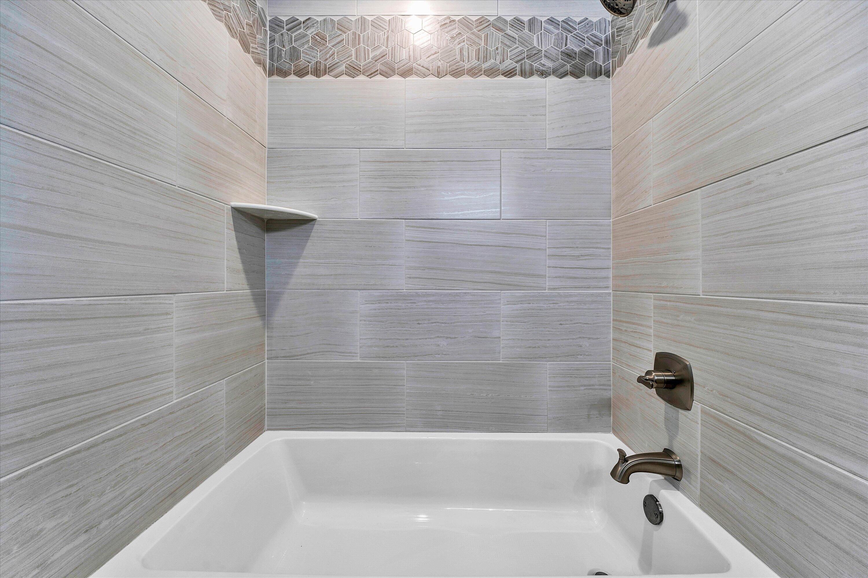 845 Gangplank Road, Unit 210 Moneta, VA 24121 - Photo 20 of 34 a bathroom with a bathtub