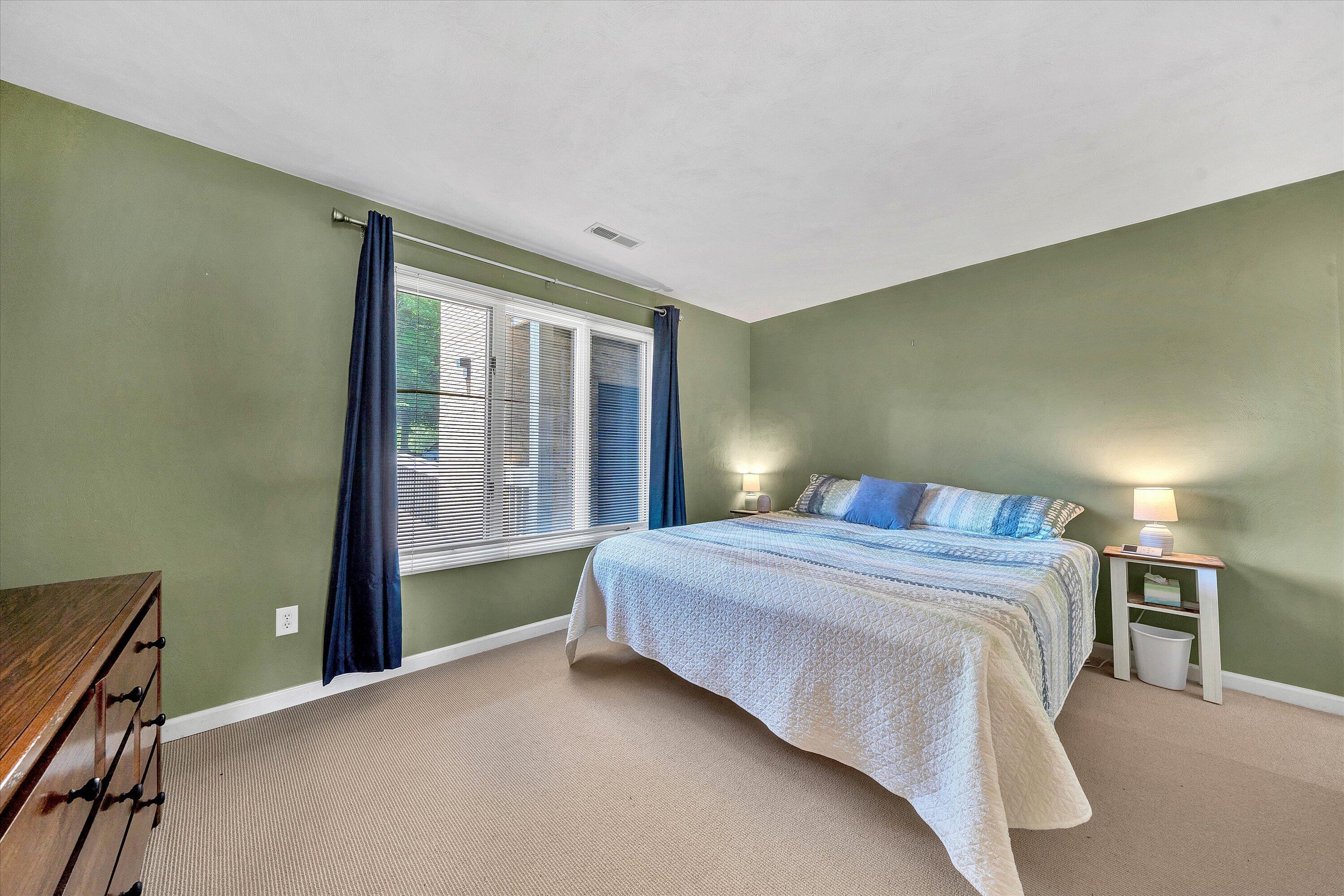 845 Gangplank Road, Unit 210 Moneta, VA 24121 - Photo 21 of 34 a bedroom with a bed and a window