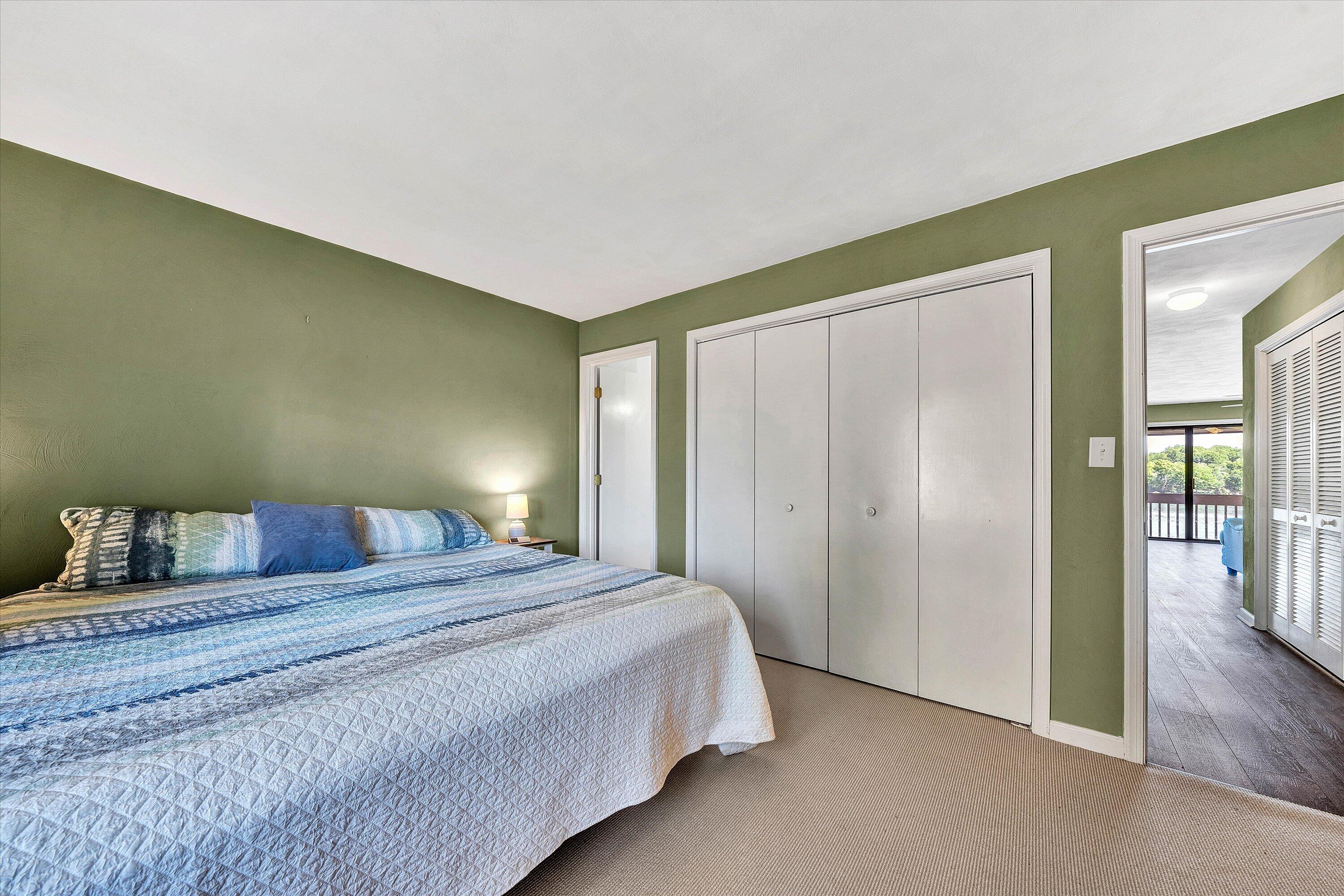 845 Gangplank Road, Unit 210 Moneta, VA 24121 - Photo 22 of 34 a bedroom with a bed and wooden floor