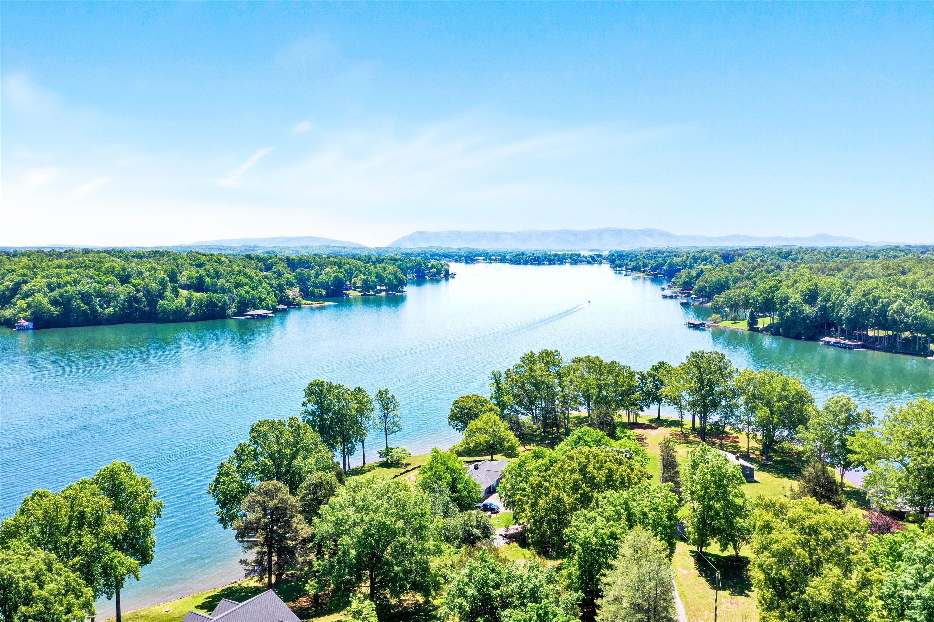 845 Gangplank Road, Unit 210 Moneta, VA 24121 - Photo 4 of 34 an aerial view of a houses with a lake view