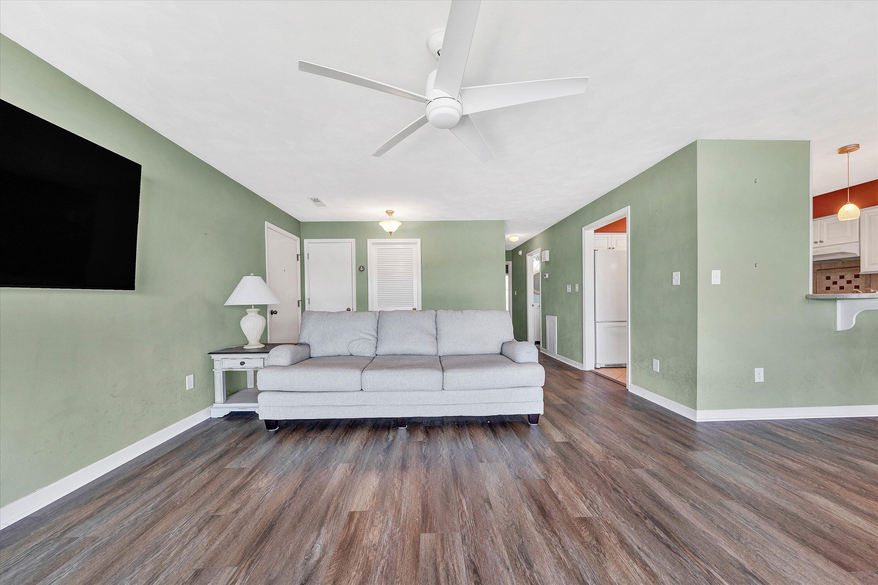 845 Gangplank Road, Unit 210 Moneta, VA 24121 - Photo 10 of 34 a living room with furniture and a flat screen tv