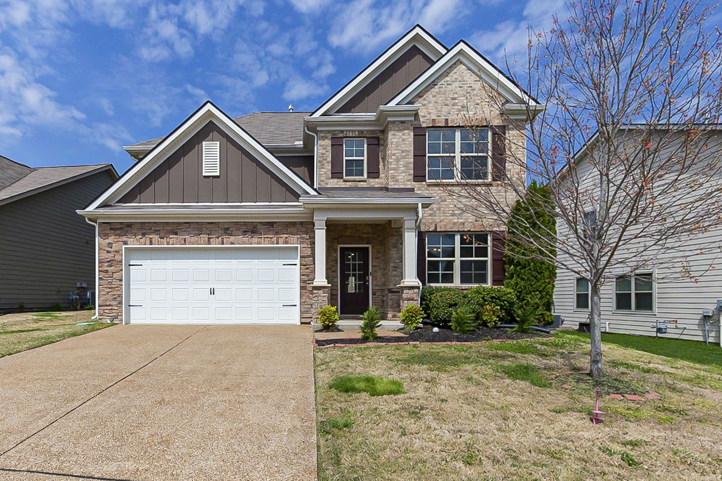 a front view of a house with garden