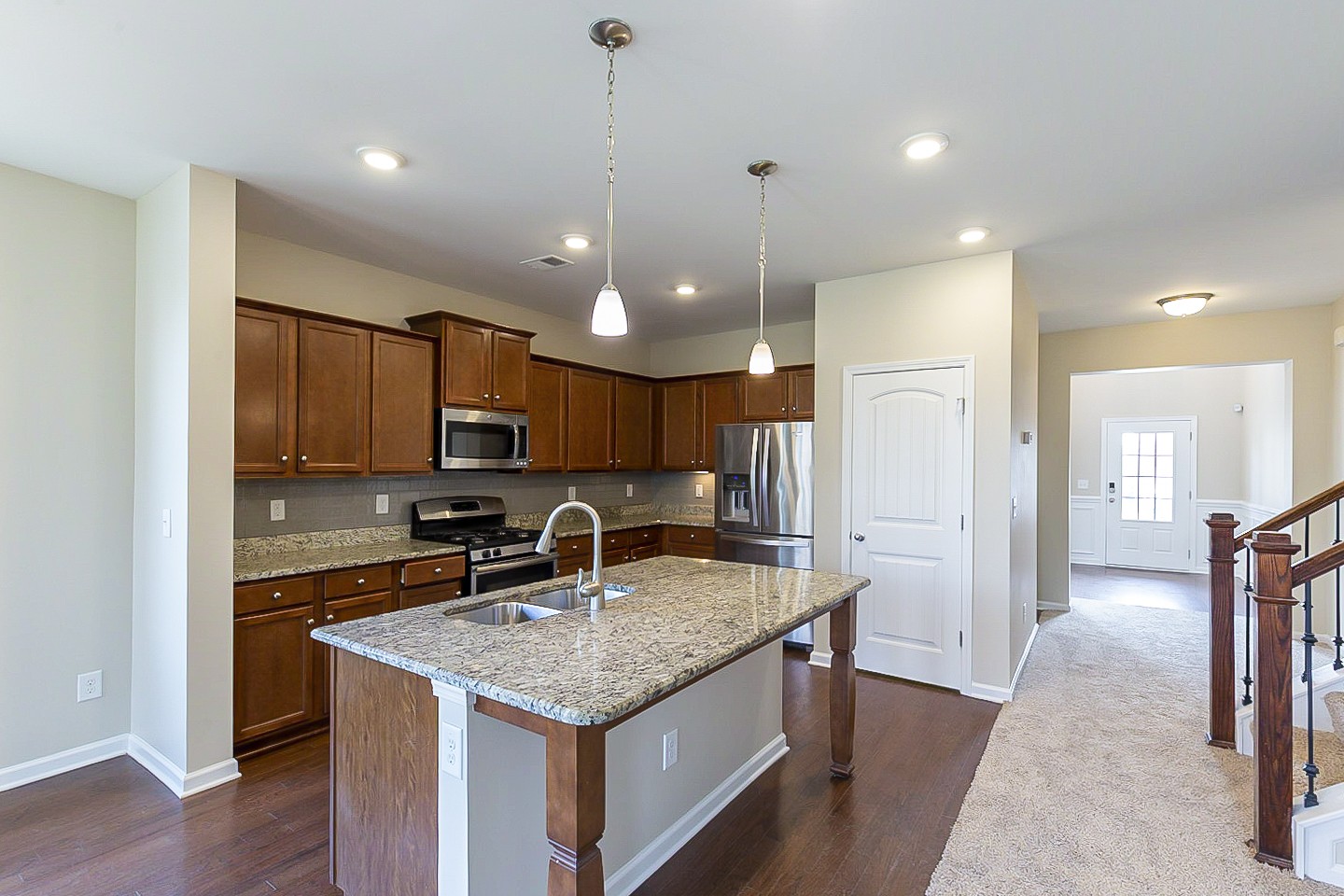 3005 Alan Drive Spring Hill, TN 37174 - Photo 8 of 31 a kitchen with center island a sink stainless steel appliances and cabinets