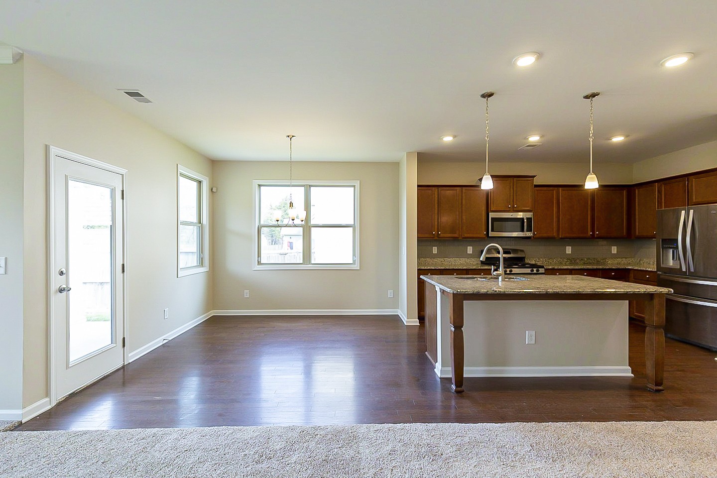 3005 Alan Drive Spring Hill, TN 37174 - Photo 10 of 31 a view of kitchen with stainless steel appliances granite countertop refrigerator stove and wooden floor