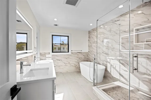 a view of a big room with wooden floor and windows