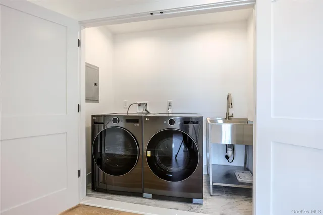 a bathroom with a double vanity sink toilet and shower