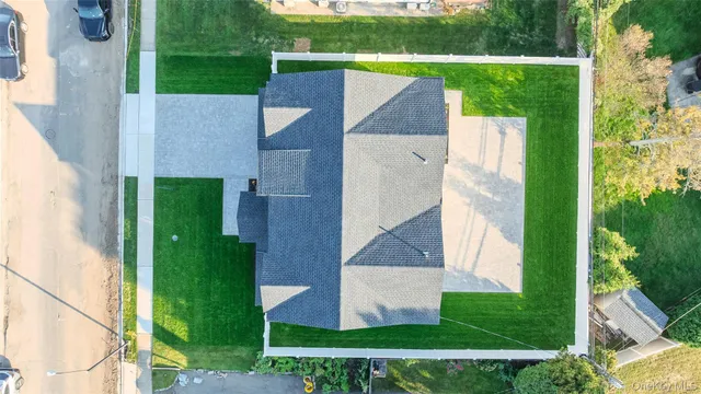 aerial view of a house with a garden and plants