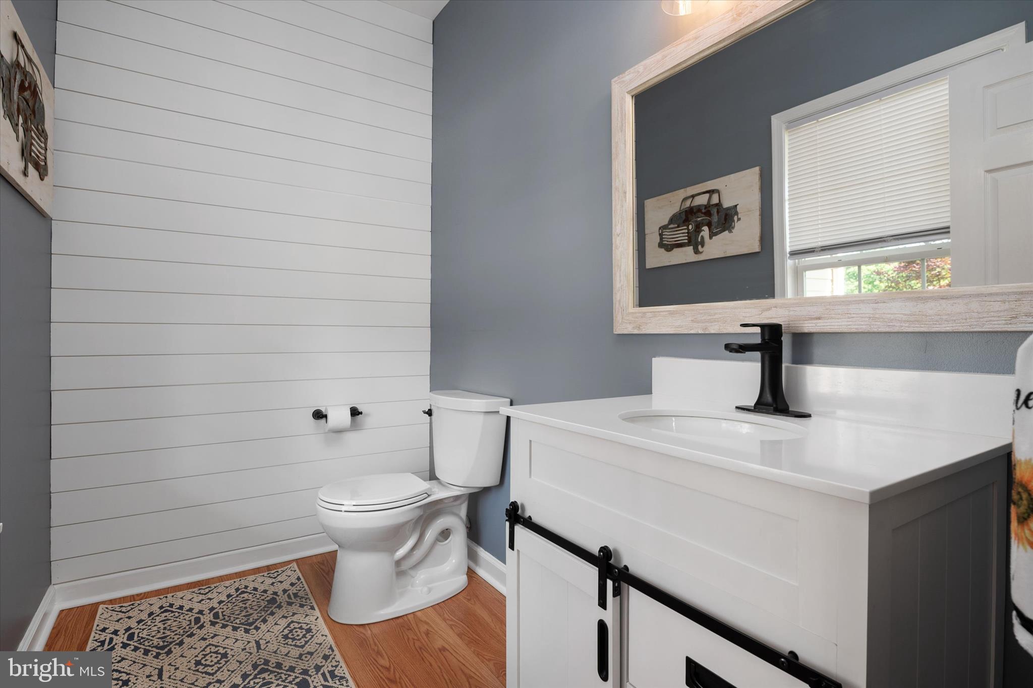 913 Clark Corner Road Centreville, MD 21617 - Photo 24 of 66 a bathroom with a sink a toilet and mirror