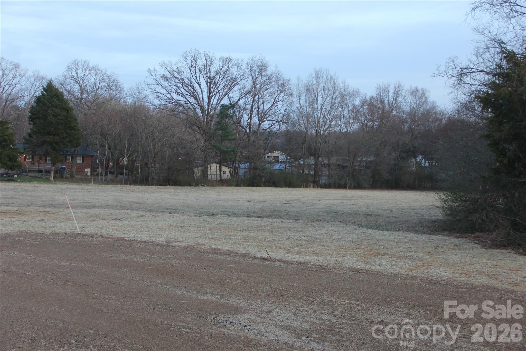 6360 Pagemont Road Kannapolis, NC 28081 - Photo 2 of 19 a view of dirt yard with trees