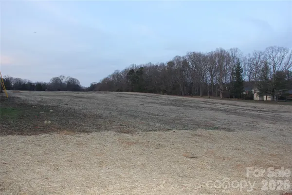 a view of dirt yard with mountain view