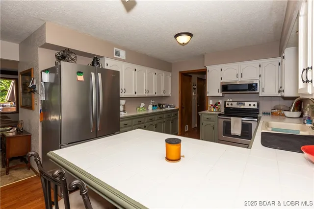 $470,000 | 776 Big Buffalo Road, Stover, MO 65078