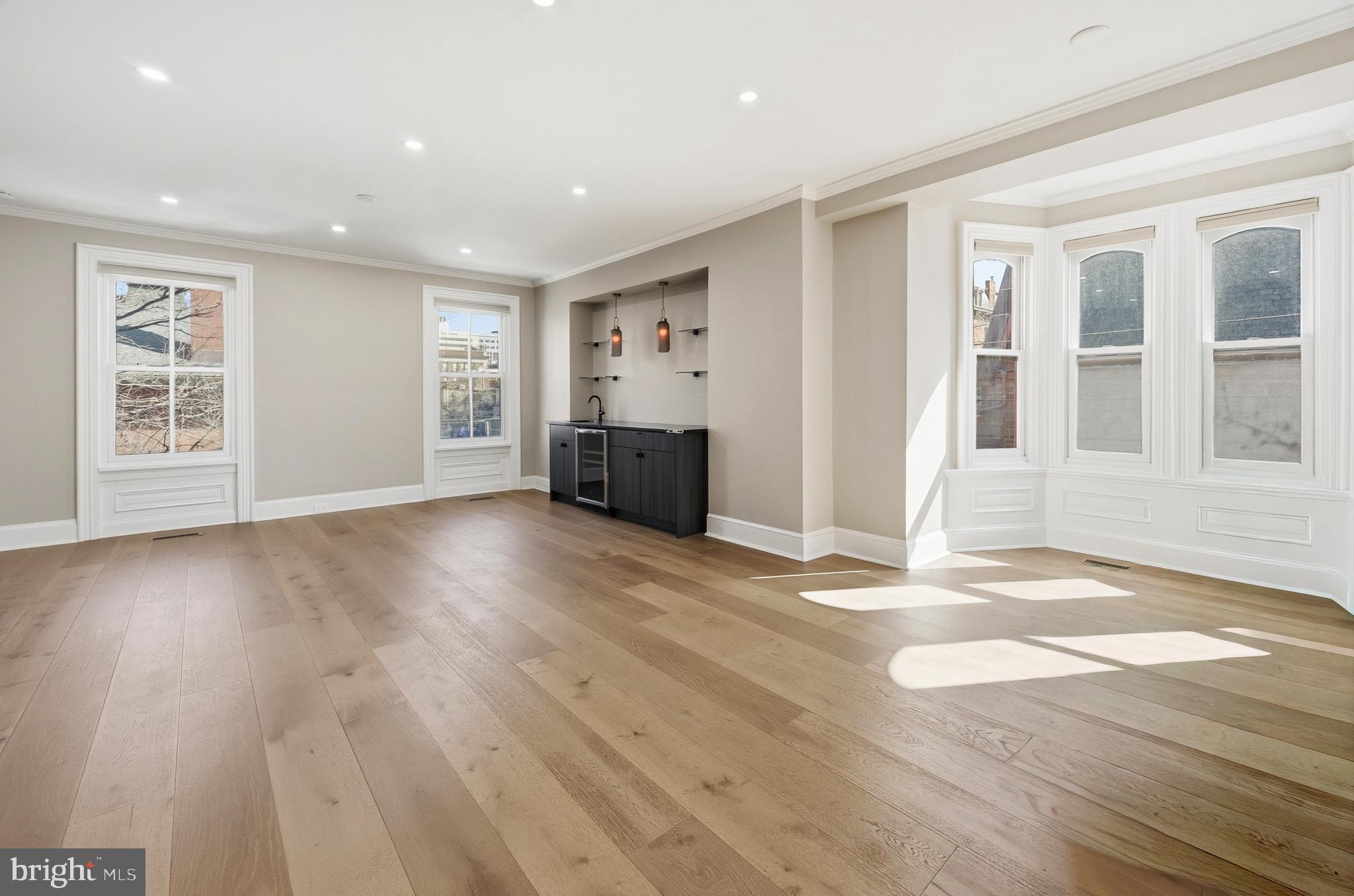 552 North 18th Street Philadelphia, PA 19130 - Photo 17 of 51 a view of a livingroom with wooden floor and window