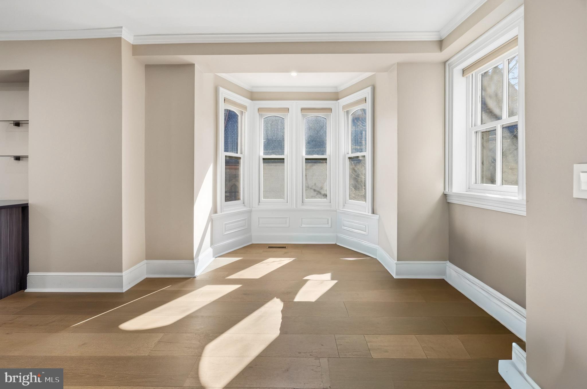 552 North 18th Street Philadelphia, PA 19130 - Photo 18 of 51 a view of an empty room with wooden floor and a window