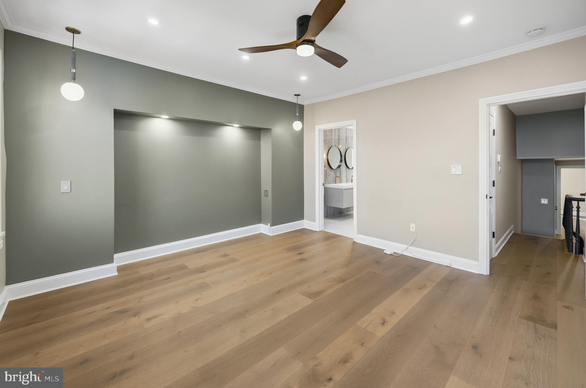 552 North 18th Street Philadelphia, PA 19130 - Photo 28 of 51 a view of an empty room with wooden floor and a ceiling fan