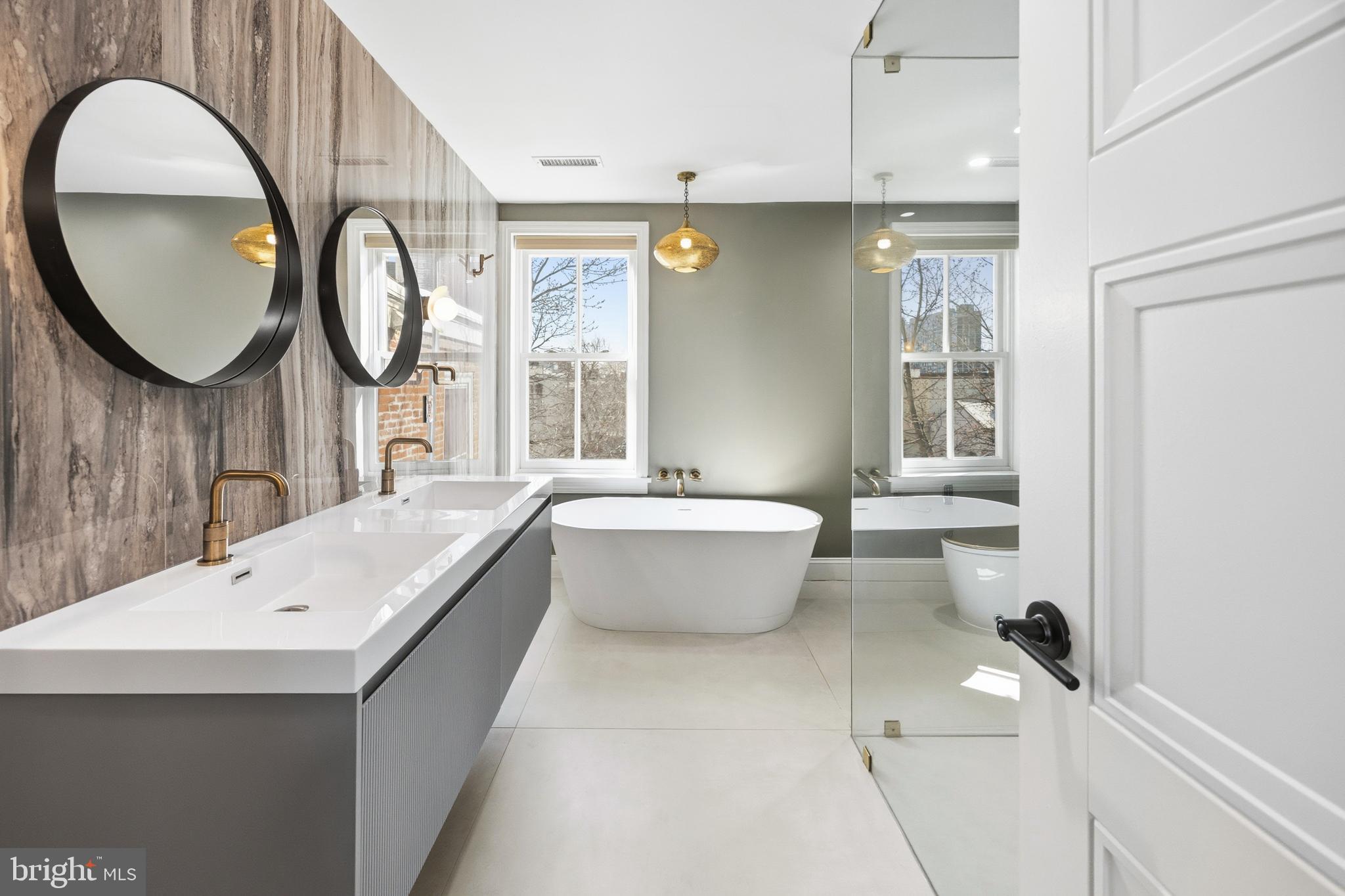 552 North 18th Street Philadelphia, PA 19130 - Photo 29 of 51 a bathroom with a tub sink and a mirror