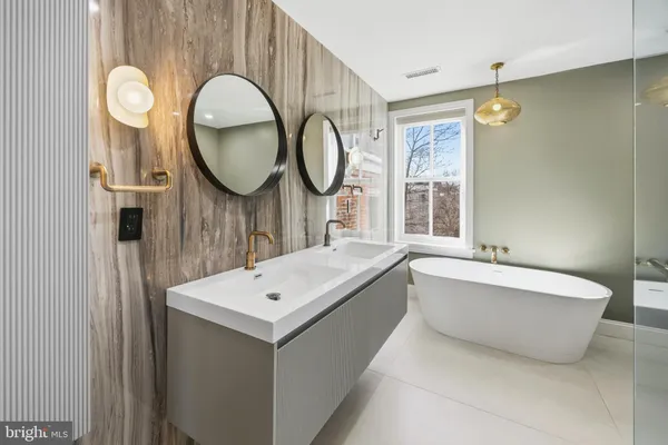a bathroom with a shower a toilet and sink