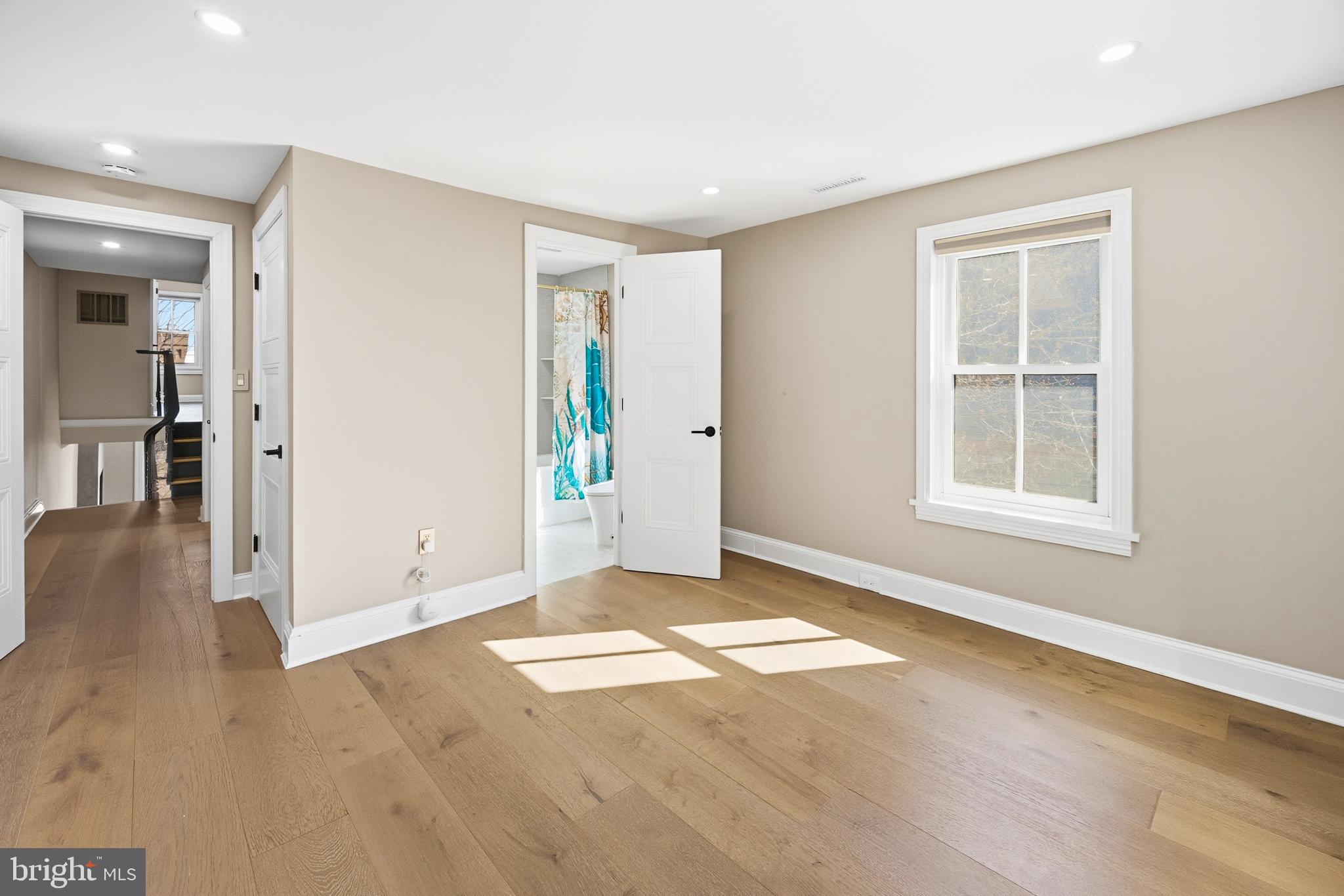 552 North 18th Street Philadelphia, PA 19130 - Photo 33 of 51 a view of an empty room with window and wooden floor